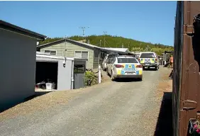  ??  ?? Police cars are parked up at the Nelson Sun Club after two people were arrested following a short chase over a suspected arson attempt near the Moutere Highway.