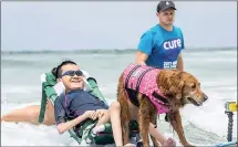  ?? Picture: Ionis Pharmaceut­icals ?? DOGGED: Although these kids have difficulty performing basic functions of life, spinal muscular atrophy does not affect their ability to think, learn, have hopes and dreams, or surf with a dog.