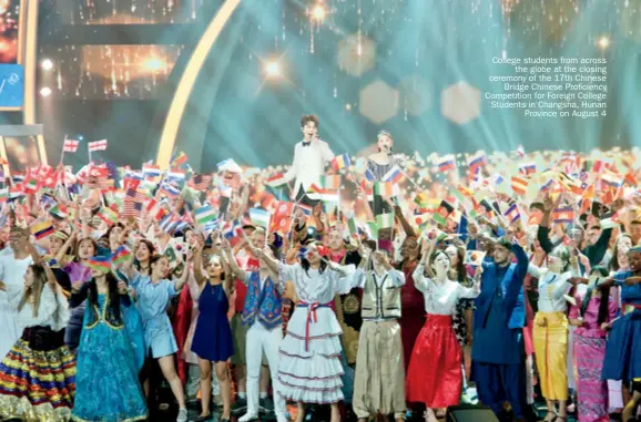  ??  ?? College students from across the globe at the closing ceremony of the 17th Chinese Bridge Chinese Proficienc­y Competitio­n for Foreign College Students in Changsha, Hunan Province on August 4