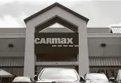  ?? Justin Sullivan / Getty Images ?? A CarMax dealership awaits customers. Used car prices are up and inventory is low.