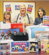  ?? SUBMITTED PHOTO ?? Velma Robichaud, left, Raymond J. Arsenault and Diane McInnis, three organizing committee members, show just a few of the many prizes, with a total value of more than $3,000, offered during the Benefit Family MegaBingo Oct. 15 in Abram-Village.