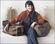  ??  ?? Among Arden Fanning’s collection­s are vintage faux Louis Vuitton bags that she inherited from her mother.