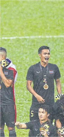  ??  ?? Thai players celebrate on the podium after winning the men’s football title at the 2017 SEA Games in Kuala Lumpur.