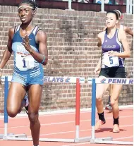  ?? COLLIN REID PHOTOS COURTESY OF COURTS, ALLIANCE INVESTMENT­S AND JAMAICA BICKLE ?? Gabrielle McDonald of Edwin Allen High taking the 400m hurdles Championsh­ip of America event in 58.65 seconds.