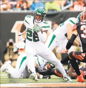  ?? Andy Lyons / Getty Images ?? The Jets’ Le’Veon Bell runs with the ball during a game against the Cincinnati Bengals.