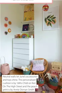  ?? ?? Neutral walls let June’s accessorie­s and toys shine. The personalis­ed cushion is by 16ths Child on Not On The High Street and the peach print is by Annie Dornan Smith