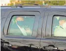  ?? ALEX EDELMAN/AFP VIA GETTY IMAGES ?? President Donald Trump waves to his supporters from the back of an SUV outside Walter Reed Medical Center in Bethesda, Md., on Oct. 4.