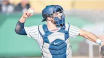  ?? KELLY SHEEHAN/AP ?? Uconn catcher Matt Donlan, a transfer from Stonehill pictured in February, loves playing for the Huskies so much there’s no need to ask if he needs a day off. He scored three runs in Uconn’s 6-5 win over Creighton on Sunday.