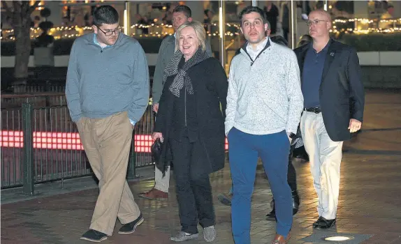  ?? Photo / Doug Sherring ?? Former US Secretary of State Hillary Clinton strolls through the Viaduct after her meal at Soul Bar on Auckland’s waterfront last night.