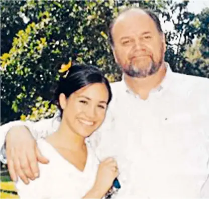  ??  ?? A family photo of Meghan and her father and, below left, Meghan’s mother Doria carried a Burberry garment bag as she left for Los Angeles airport yesterday on her way to the wedding