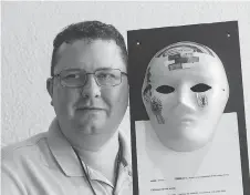  ??  ?? Murray MacDonald’s mask has pictures of an insect that may have caused his health issues, a large brick wall representi­ng his stubbornne­ss and a rainbow for the brain injury associatio­n.