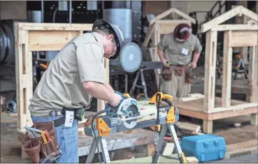  ??  ?? Carpentry contestant­s competing in the High School SkillsUSA regional qualifier held at Georgia Northweste­rn Technical College’s Walker County Campus on November 30.