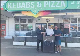  ??  ?? TONY’S Kebabs and Pizza owner Tony Androos is presented with a Te Puke High School T-shirt by promising rugby player Lukas Harris and coach Jackson Reuben-Swinton.
