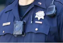  ?? Associated Press ?? San Francisco Police Officer Joe Juarez wears a body camera on May 13 while patroling outside of AT&T Park before a baseball game between the San Francisco Giants and the Cincinnati Reds.