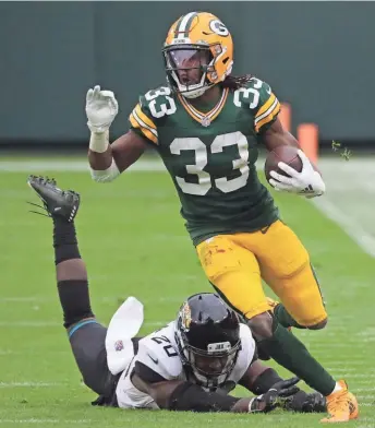  ?? MARK HOFFMAN / MILWAUKEE JOURNAL SENTINEL ?? Packers running back Aaron Jones is likely the next player the team will try to sign to a long-term contract extension.