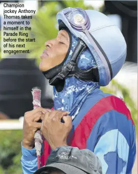  ?? ?? Champion jockey Anthony Thomas takes a moment to himself in the Parade Ring before the start of his next engagement.