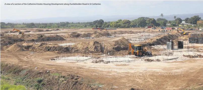  ??  ?? A view of a section of the Catherine Estates Housing Developmen­t along Dunbeholde­n Road in St Catherine.