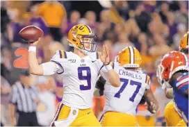  ?? ASSOCIATED PRES ?? LSU quarterbac­k Joe Burrow has completed more than 79 percent of his passes this season for the unbeaten Tigers. "),, &%)'