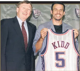  ?? N.Y. Post Charles Wenzelberg (3) ?? LEGENDARY STATUS: Rod Thorn and Jason Kidd were all smiles after Thorn pulled off a risky trade to bring the star point guard to New Jersey from Phoenix in July 2001. The next spring they celebrated the first of two straight Eastern Conference titles (left).