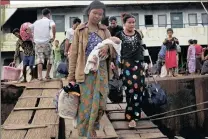  ?? PICTURE: EPA ?? Displaced Rakhine ethnic people from Maungdaw township arrive at the port of Sittwe.