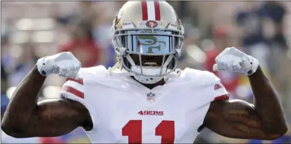  ??  ?? In this Dec. 31, file photo, San Francisco 49ers wide receiver Marquise Goodwin gestures as he comes onto the field before an NFL football game against the Los Angeles Rams, in Los Angeles. The 49ers have signed Goodwin to a three-year contract...