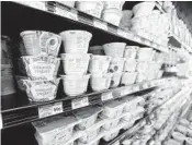  ?? GERALD HERBERT/AP 2018 ?? While the average grocery store has more than 300 yogurt products, U.S. yogurt sales are in a multiyear slump.