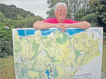 ??  ?? Colourful leader: Lisa Webber will be front and centre for the Whitby Walkfest on March 24, with an updated – and smaller– walkway map not far from her reach.