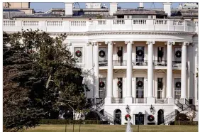  ?? ANDREW HARNIK / AP ?? A portion of a famed magnolia tree at the White House was cut back Wednesday while President Donald Trump and his family are away for the holidays.