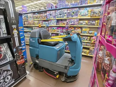  ??  ?? An automated floor cleaner can be seen cleaning at the Natrona Heights Walmart location.