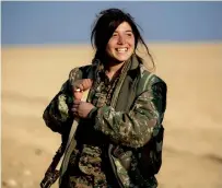  ?? AFP ?? Rougine, a 19-year-old female fighter, stands near the village of Al Torshan, 20km on the outskirts of Raqa. —