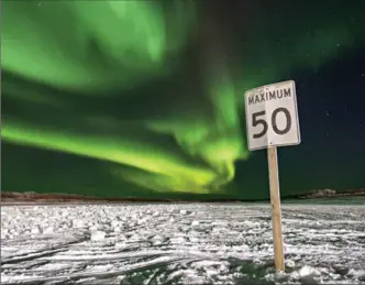  ?? CHRIS MILLER, NEW YORK TIMES ?? The northern lights illuminate the night sky Inuvik, Northwest Territorie­s in January. Old models of northern developmen­t that depend on resource megaprojec­ts are of limited use these days, policy researcher­s say.