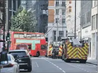  ??  ?? CALL TO ACTION: Emergency services in Knightsbri­dge, central London, tackle a fire on the roof of the Mandarin Oriental Hyde Park, close to Harrods, which sent huge plumes of black smoke over the city.