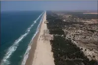  ?? LEO CORREA — THE ASSOCIATED PRESS ?? Filao trees, planted to slow coastal erosion along the Atlantic Ocean, line the beach in Lompoul village near Kebemer, Senegal, on Friday.