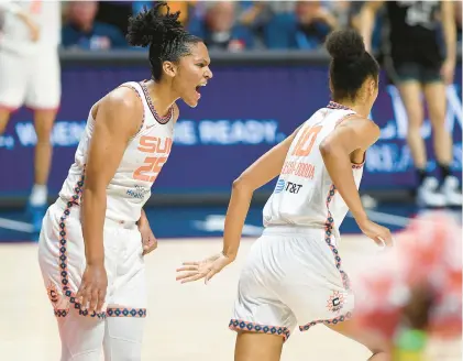  ?? SARAH GORDON/THE DAY ?? The Sun’s Alyssa Thomas, left, celebrates a basket against the Liberty with Olivia Nelson-ododa during the first half of a game June 27 in Uncasville.