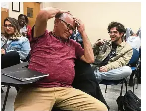  ?? — Tribune News Service ?? Valencia laughing during class at Cal State Long Beach recently. He is a 63-year-old junior at the college.