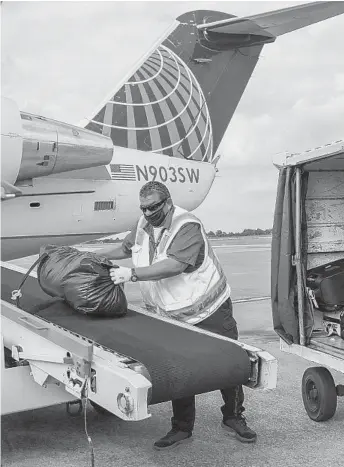  ?? DENISE CATHEY AP ?? Several airlines have said recently that they need more aid from the federal government and have already furloughed thousands. Airlines in the United States received $25 billion in aid under the federal CARES Act in March, as well as another $25 billion in payroll grants to keep workers employed. House Speaker Nancy Pelosi said recently that she was willing to move forward on aid for airlines as part of a broader bill or separate legislatio­n. However, some critics say the airline industry has made poor financial decisions in the past few years.