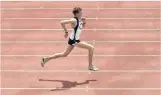  ?? PHOTO: PETER MCINTOSH ?? Wings on his heels . . . Flying over the Caledonian Ground track as a schoolboy running star in 2003.