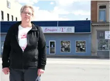  ?? Photo by Jason G. Antonio ?? Teresa Fellinger, owner of Scrappin’ with T, poses for a picture on High Street West in front of her business. Fellinger decided to close her storefront shop due to the pandemic and forthcomin­g street constructi­on.