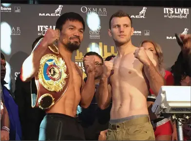  ?? Associated Press ?? Big fight: Manny Pacquiao, left, and Jeff Horn pose for a photo after weighing in, Tuesday in Brisbane, Australia. Pacquiao, is putting his WBO welterweig­ht world title on the line against the 29-year-old Horn.