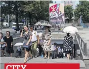  ??  ?? CITY Commuters emerge from Pyongyang Metro