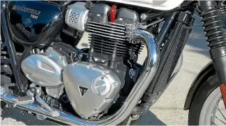  ??  ?? You can tell the 900cc twin from the 1200cc by the lack of faux carburetto­rs on intake tracts.