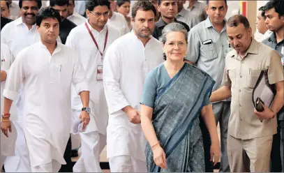  ?? PICTURE: EPA ?? Congress president Sonia Gandhi, centre right, and her son congress vice-president Rahul Gandhi, centre, leave after casting their votes at the parliament in New Delhi, yesterday, when lawmakers began voting to elect a new president.