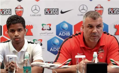  ?? Photo by Juidin Bernarrd ?? Cosmin Olaroiu, coach of Al Ahli and Waleed Ambar, young player, address during the Press conference at Meydan Hotel in Dubai on Tuesday. —