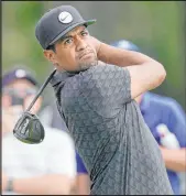  ?? Carlos Osorio The Associated Press ?? Co-leader Tony Finau follows through on a drive from the 14th tee Saturday in the Rocket Mortgage Classic’s third round.