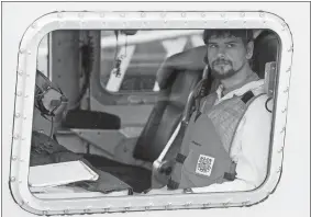  ?? MICHAEL DWYER/AP PHOTO ?? Nathan Carman arrives in a small boat Tuesday at the Coast Guard station in Boston.