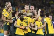  ?? TERTIUS PICKARD — THE ASSOCIATED PRESS ?? Australia players celebrate after winning a Women's World Cup quarterfin­al against France on Saturday.