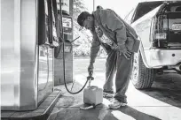  ?? Dustin Chambers / Washington Post ?? Jerald White fills a gas container May 13 in Morrow, Ga., amid panic buying over the attack on the Colonial Pipeline.