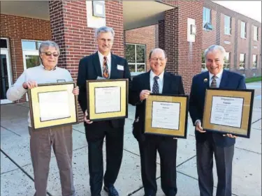  ?? PHOTO COURTESY OF POTTSTOWN SCHOOL DISTRICT ?? Inducted into the Alumni Honor Roll Friday were, from left, Robert Smale, who accepted for his late brother Jim Smale, Terry Ziegler, Jim Kerr and Bruce L. Moyer.