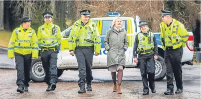  ??  ?? Roseanna Cunningham with PC Blair Wilkie, PC Daniel Sutherland, Special Constable Mike Flaherty, Special Constable Cheryl Black and PC Doug Darling at Blair Castle Estate.