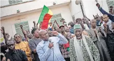  ?? | AFP ?? ACTIVISTS of the Yerewolo civil society group during an impromptu meeting of different panAfrican­ist groups in Mali, after a decision of the Economic Community of West African States to impose sanctions on the country.